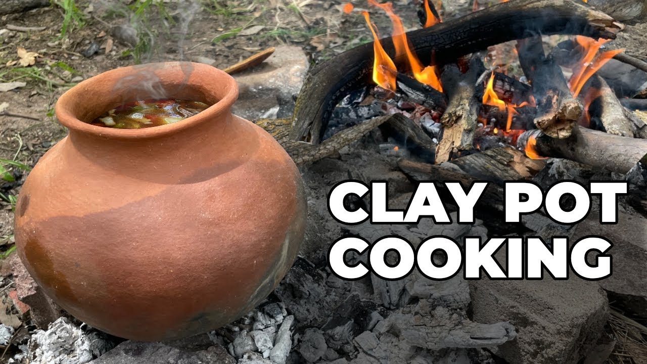 Cooking Stew in a Clay Pot on a Campfire