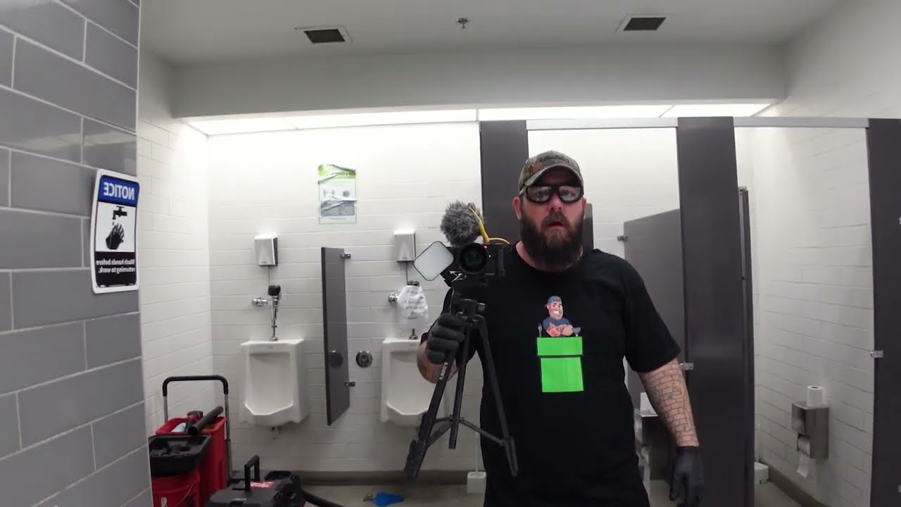 How to unclog a plugged urinal in a factory