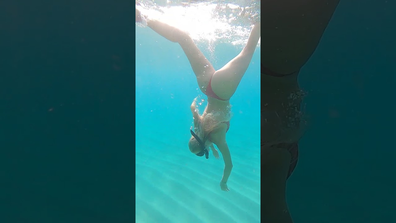 the water was so blue and she wanted to play in the sand