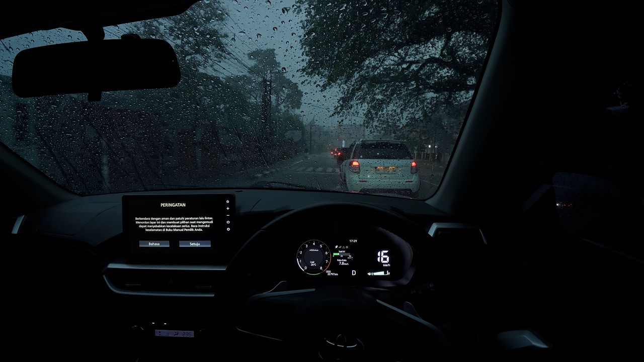Driving in heavy rain towards night