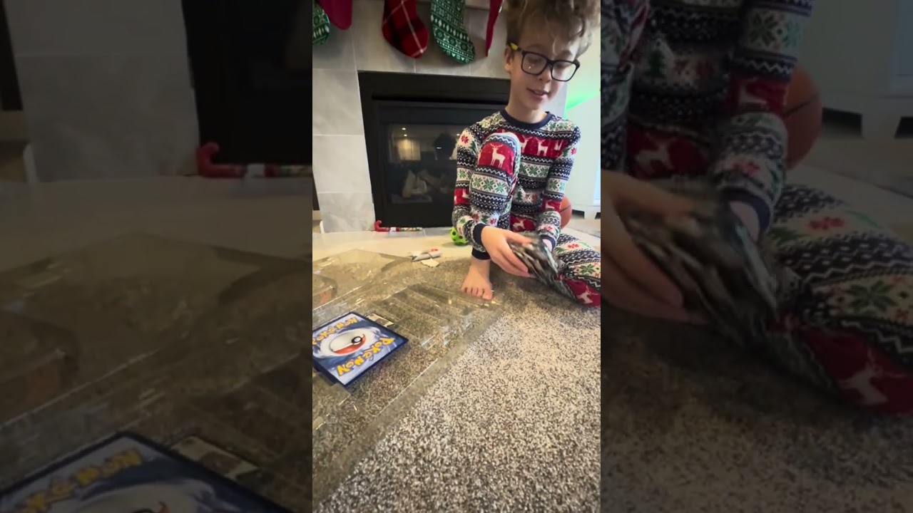 It's Christmas morning. 2025. Ripping fresh Pokemon packs and sports cards packs basketball football