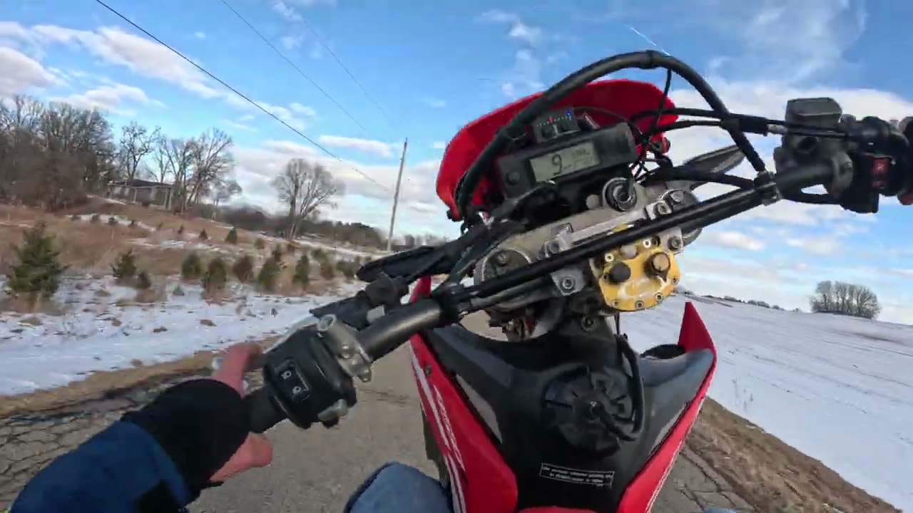 Honda 450l riding in snowy muddy conditions 