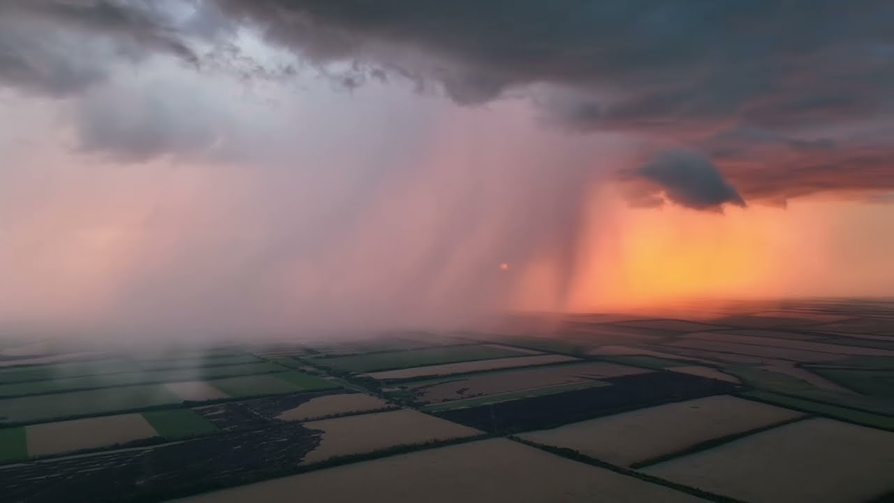 War in Ukraine: stormy sunset over the battlefield.