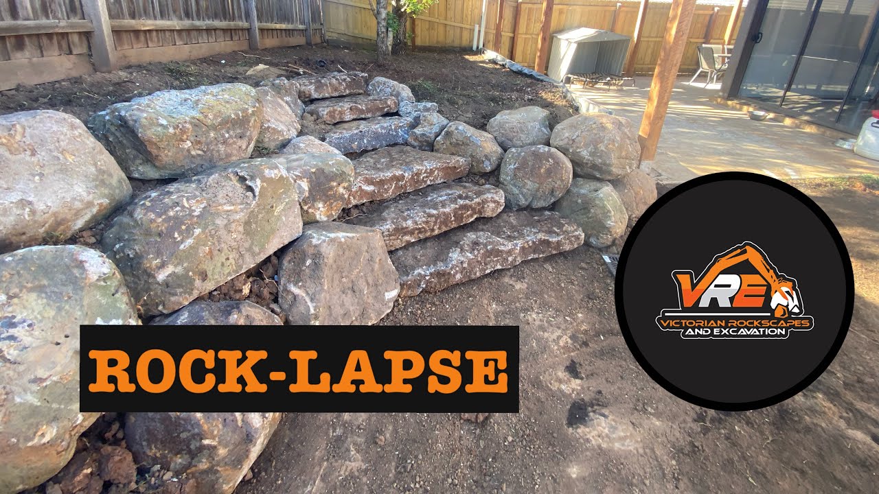 Transforming a backyard with a natural rockwall