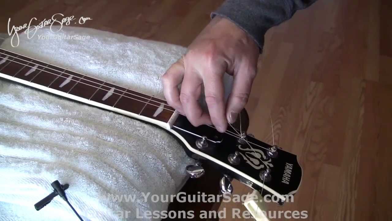 Changing Strings on an Acoustic Guitar - Part 2 - Easy Video