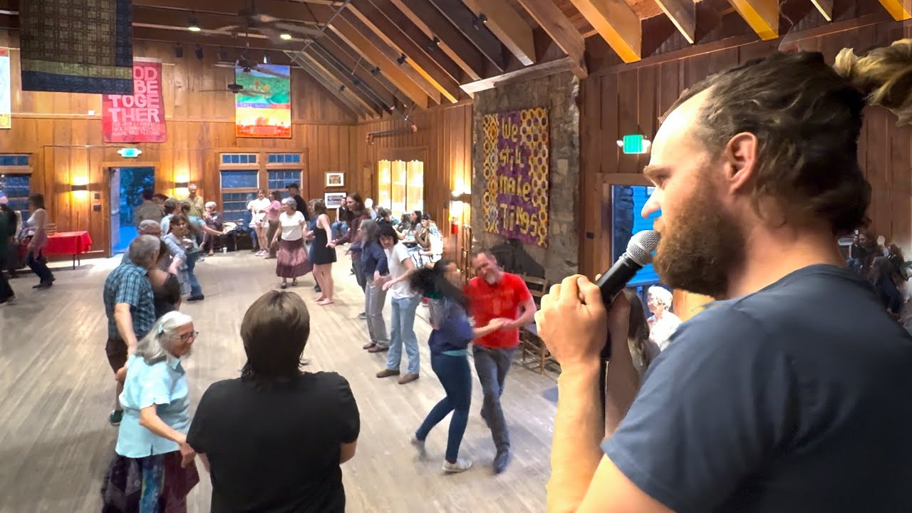 Evan Conklin calls a contra dance at the John C. Campbell Folk School