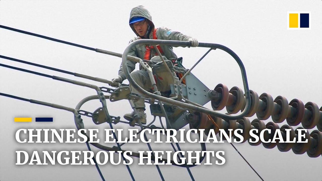 Chinese electricians scale dangerous heights to work on high-voltage lines