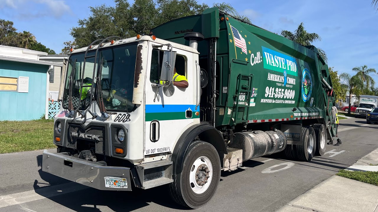Roaring Waste Pro Mack MRU McNeilus Rear Loader Garbage Truck Packing Trash in Trailer Parks