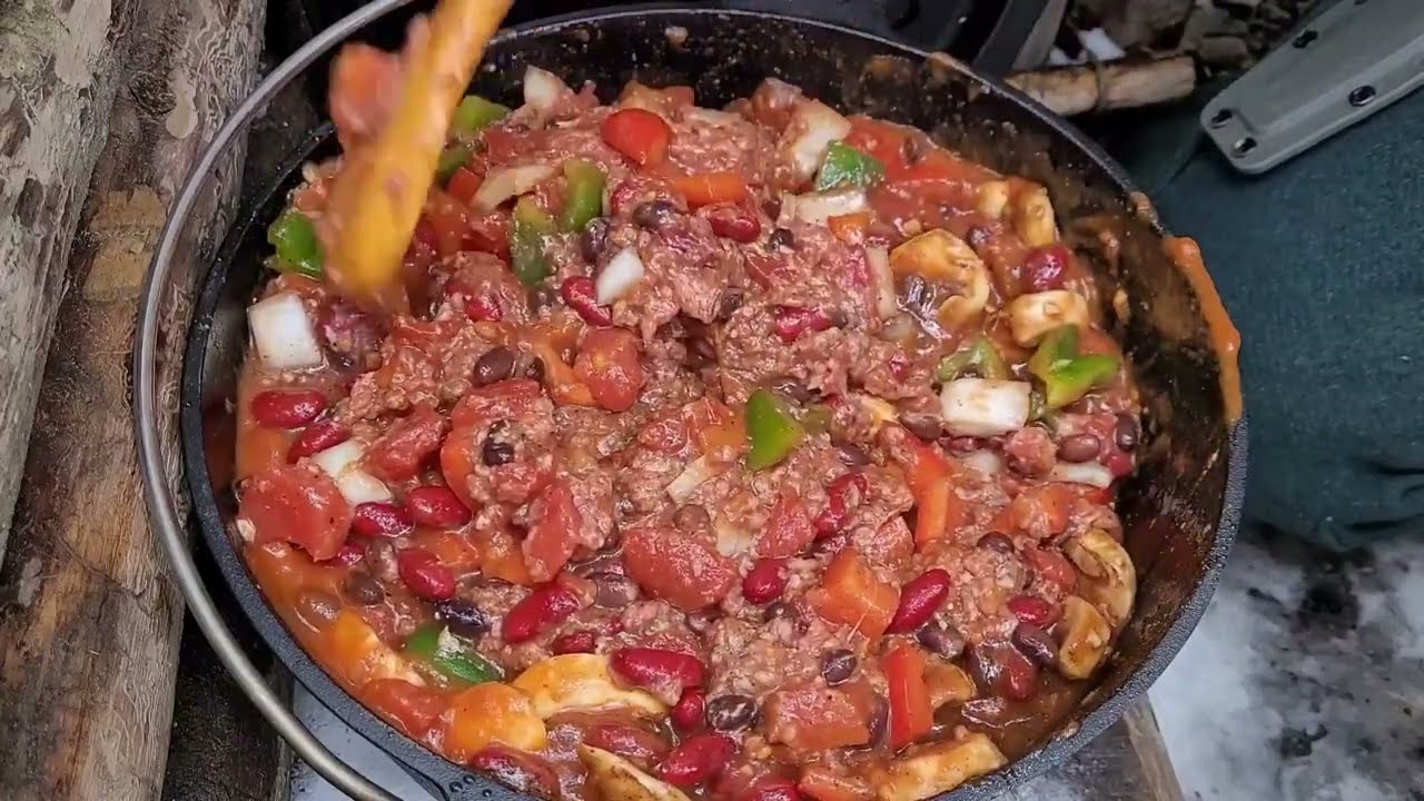 Lean-to. Chili In Dutch Oven. 3 Carved Wooden Spoons.