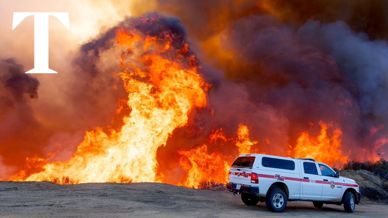Wildfires burn through the night around Los Angeles