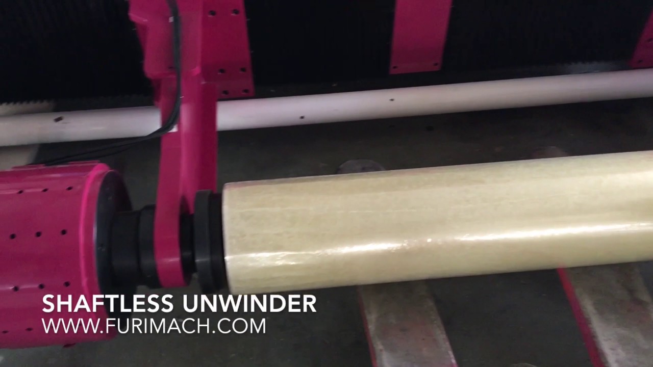 SHAFTLESS UNWINDER SYSTEM FOR HIGH SPEED SLITTING MACHINE