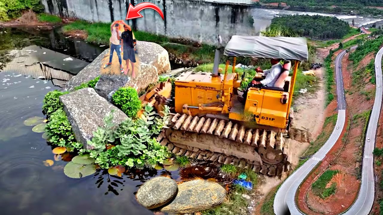 Amazing Komatsu D31P Bulldozer Working Skills! Powerful Komatsu Bulldozer Pushing Rocks Near River.