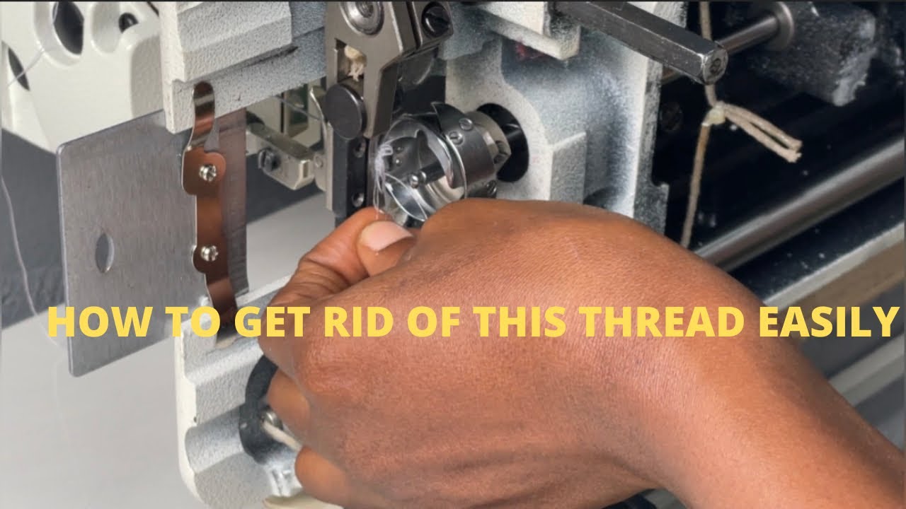 My Emel industrial Machine stuck. HOW to unhook it and Remove THREAD that is stuck on the hook