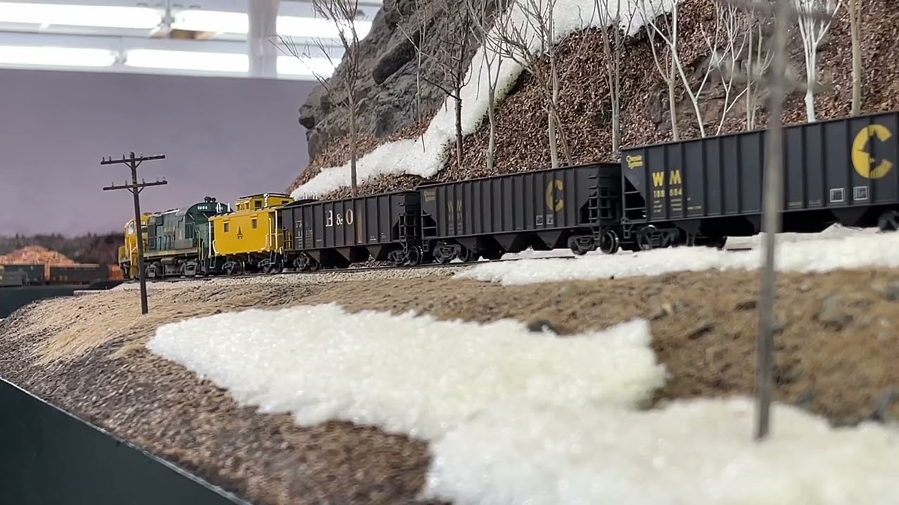 Heavy coal drag up the mountain on the Allagash Rwy! With pushers!