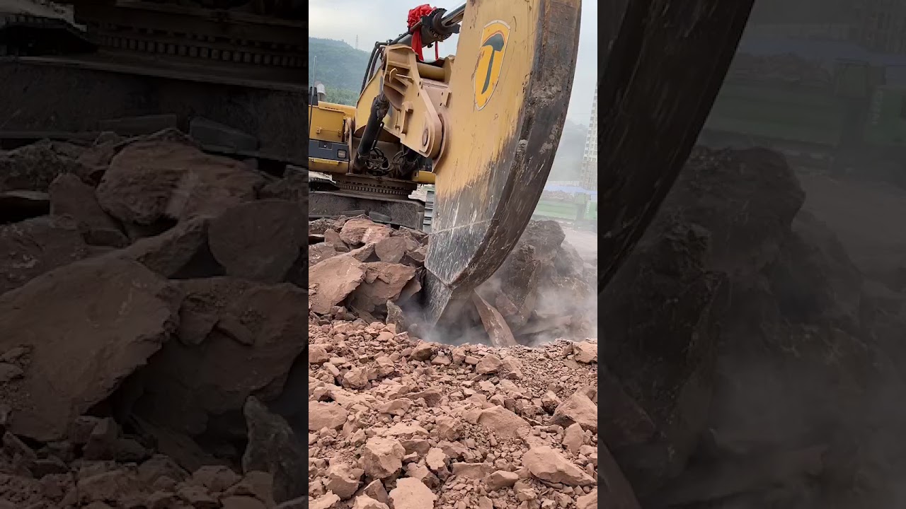 Excavator ripping the rock