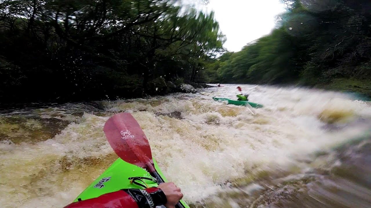 High water kayaking on the river dart