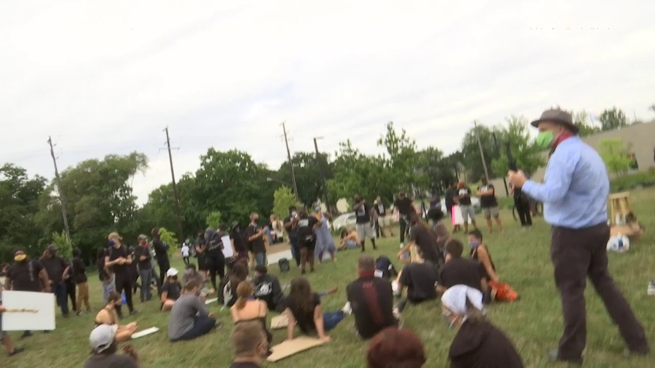 Anti-police protesters gather at Rockford Police HQ