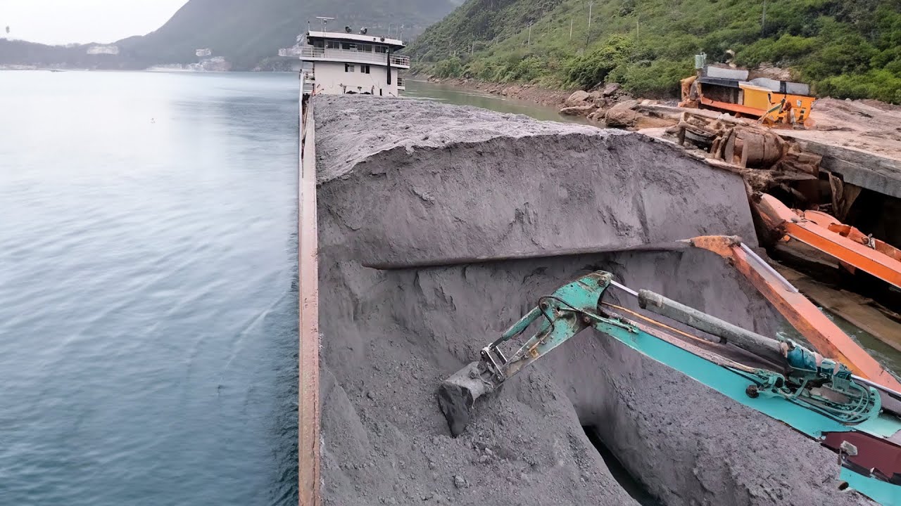 Barge unloading Substituting human labor with excavators for cargo handling.