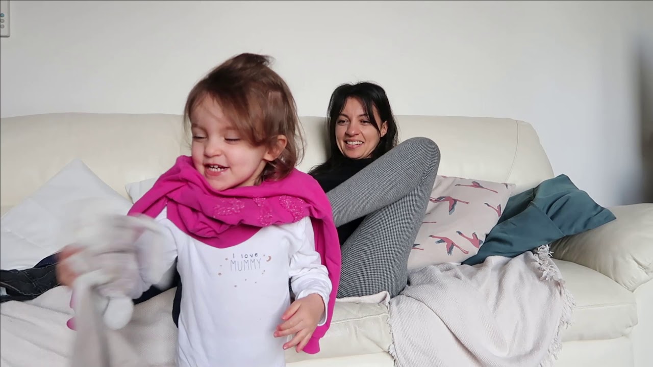 Armless mom dressing toddler