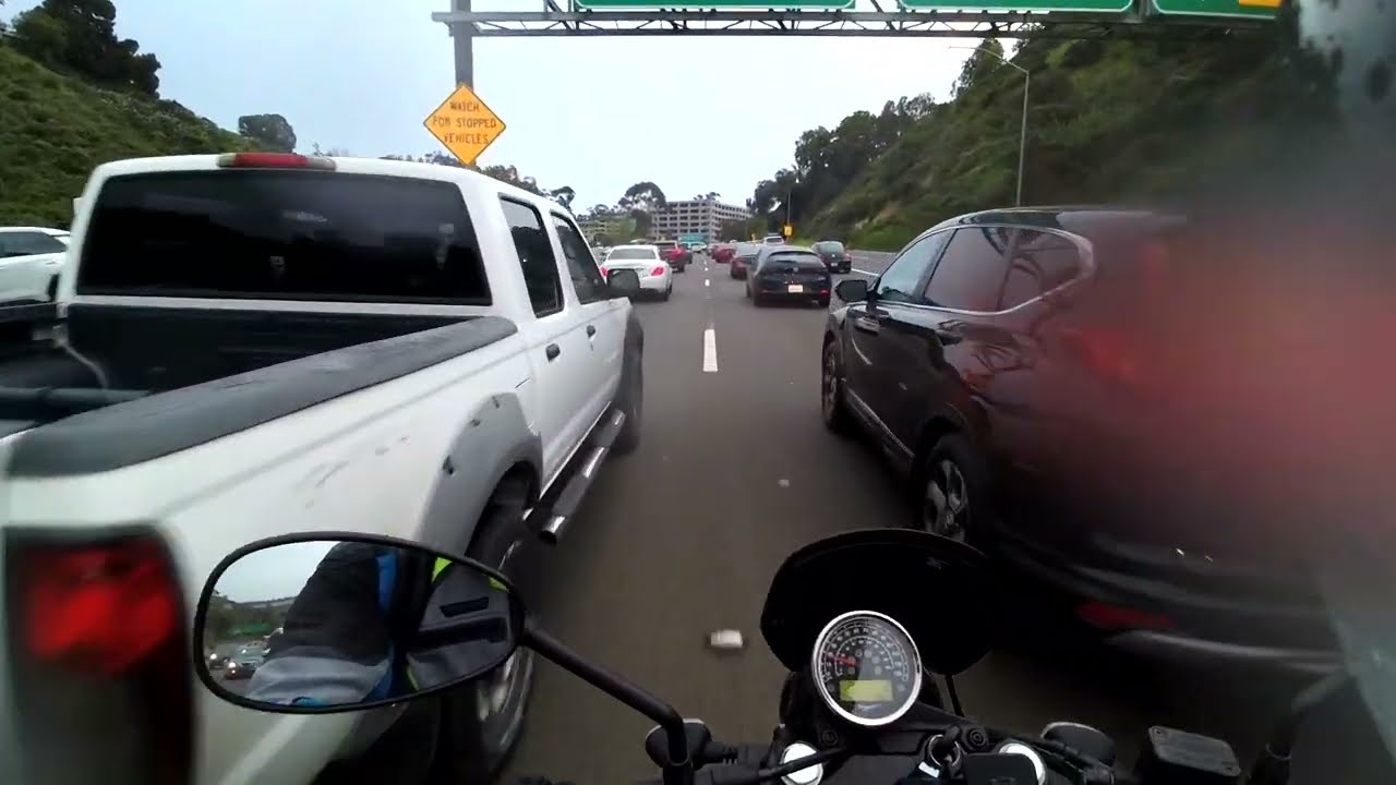 Lane splitting in San Diego on a rainy day on my Moto Guzzi V7III Stone