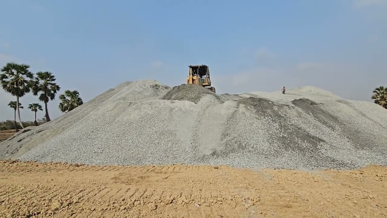 Bulldozer Pushing Rocks at Construction site