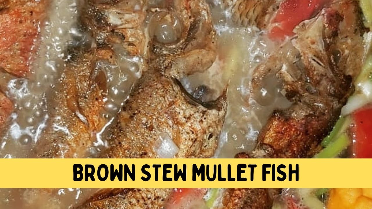 BROWN STEW MULLET FISH QUICK AND SIMPLE MEAL SERVED WITH YAM, BOILED BANANAS AND DUMPLINGS