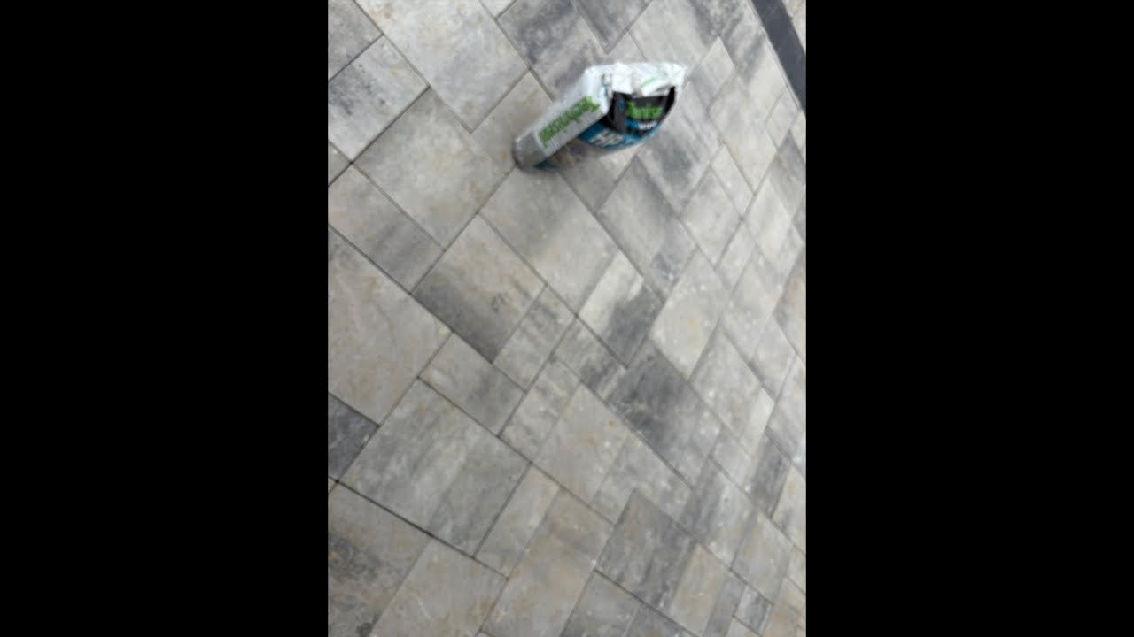 Putting down polymeric sand for a paver patio!
