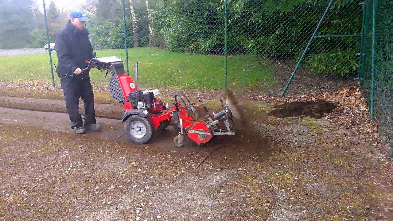 K1500 removing moss and more from a neglected tennis court