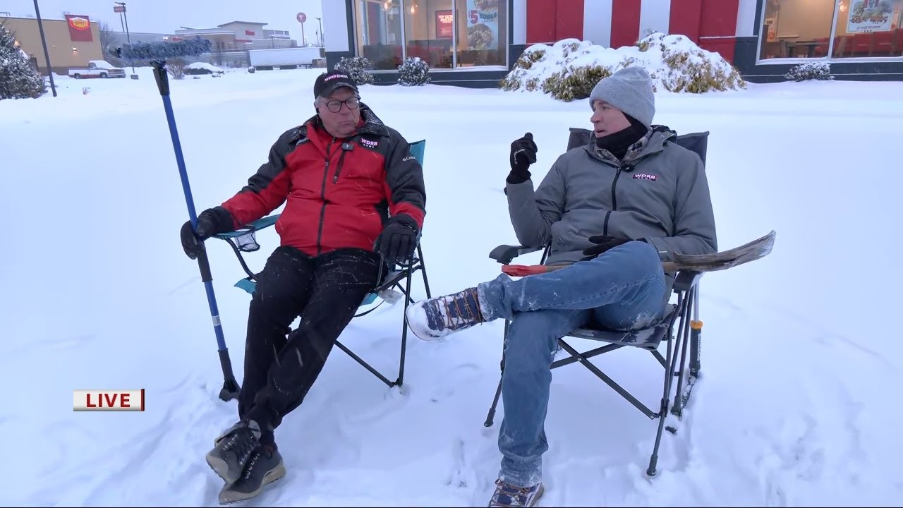 Jude Redfield and Richard Essex show the latest snow conditions in southern Indiana