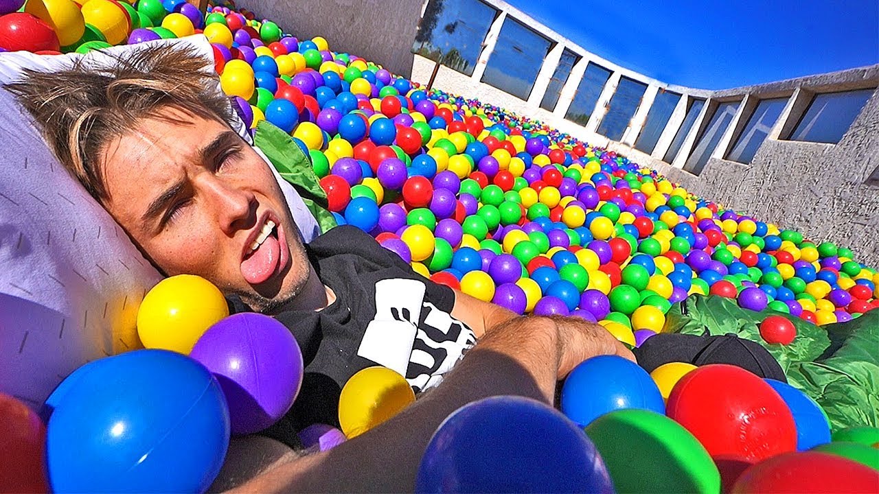 24 HOUR CHALLENGE IN OUR ROOFTOP BALL PIT! (100,000 BALLS)