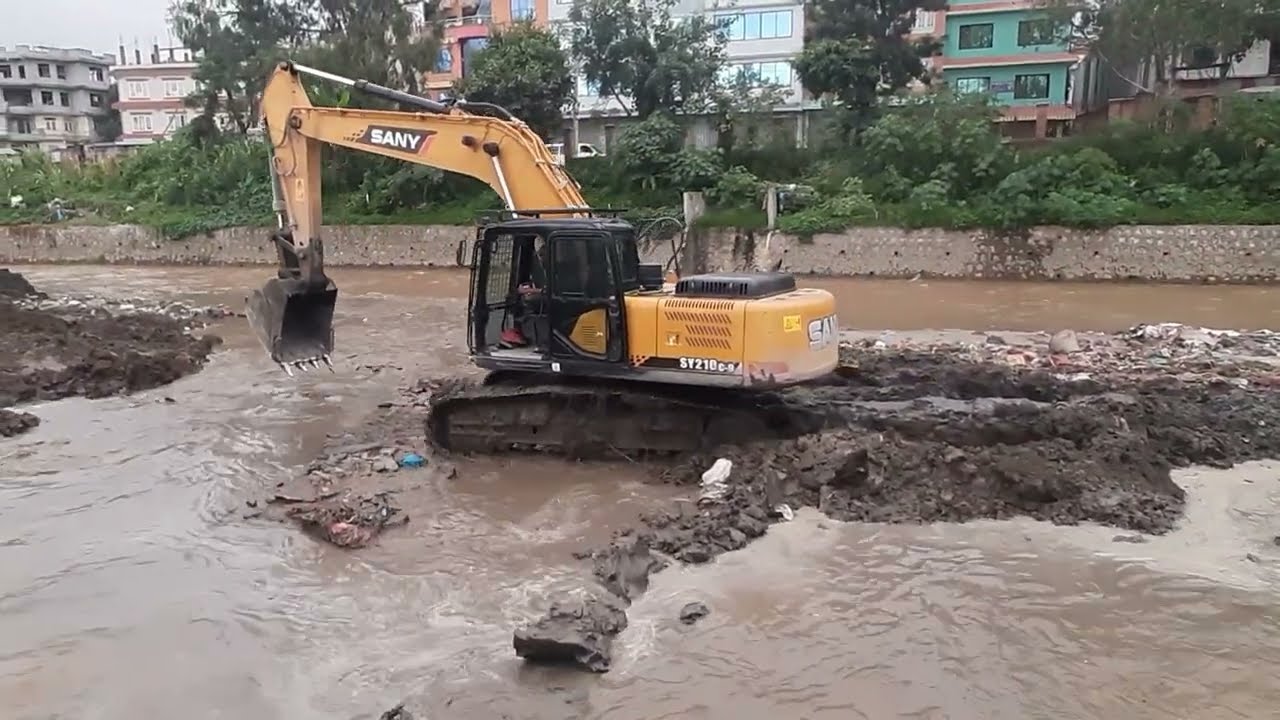 Excavator Working on River