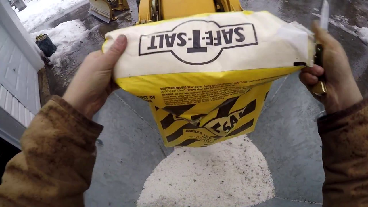 Hooking up the 110 TLB loader mount salt spreader and spreading salt
