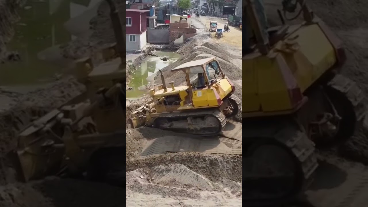 Amazing bulldozer pushing sand