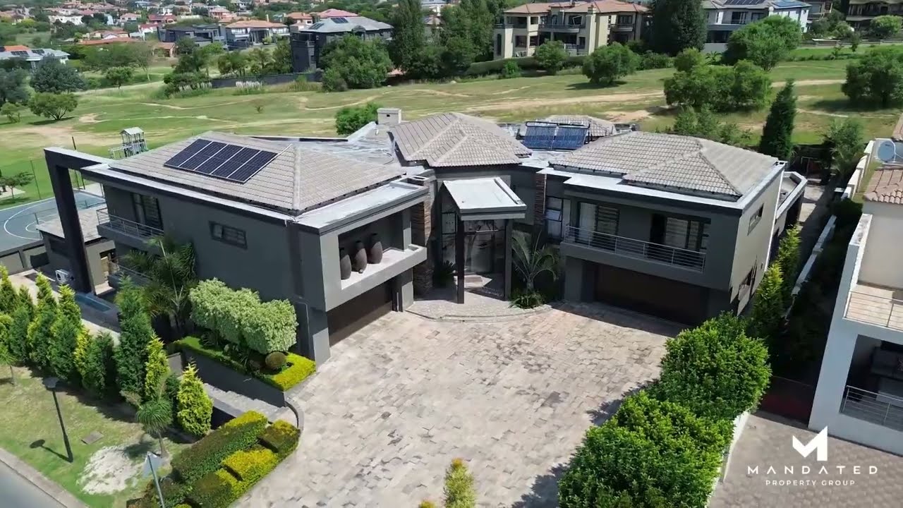 Iconic Triple Level Masterpiece in Blue Valley Golf Estate