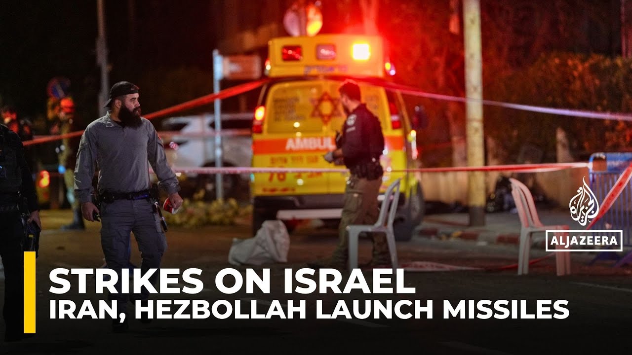 Israel under fire as Iranian missiles, Hezbollah rockets test defences