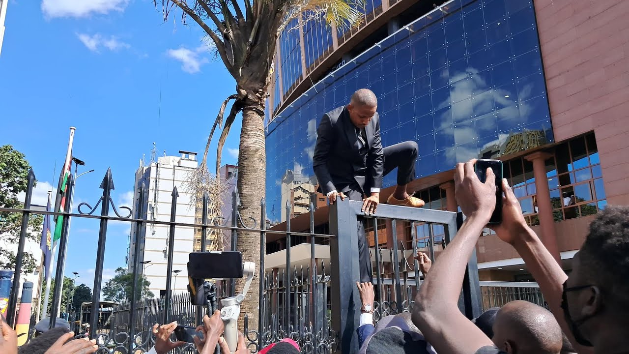 MP Babu Owino Jumps over Parliament Gate to join Protesters who had stormed Parliament buildings!!