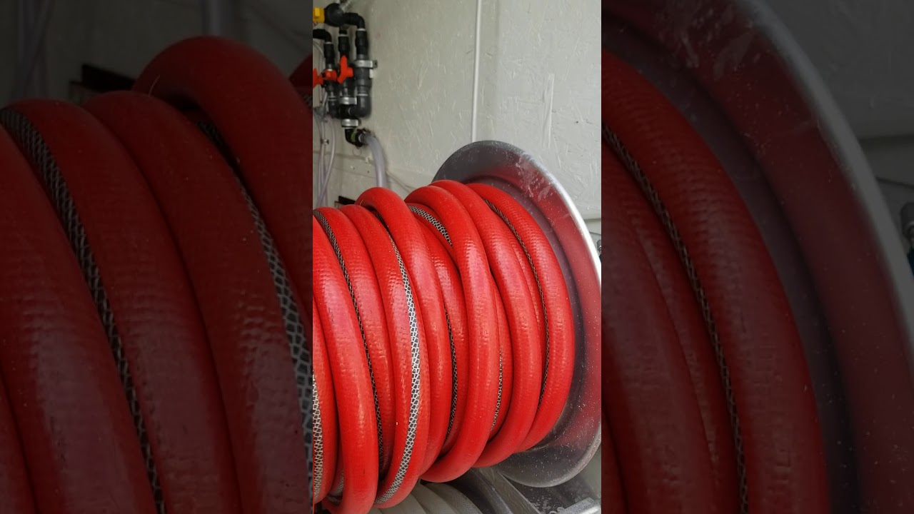 Enclosed trailer pressure washing and softwash system