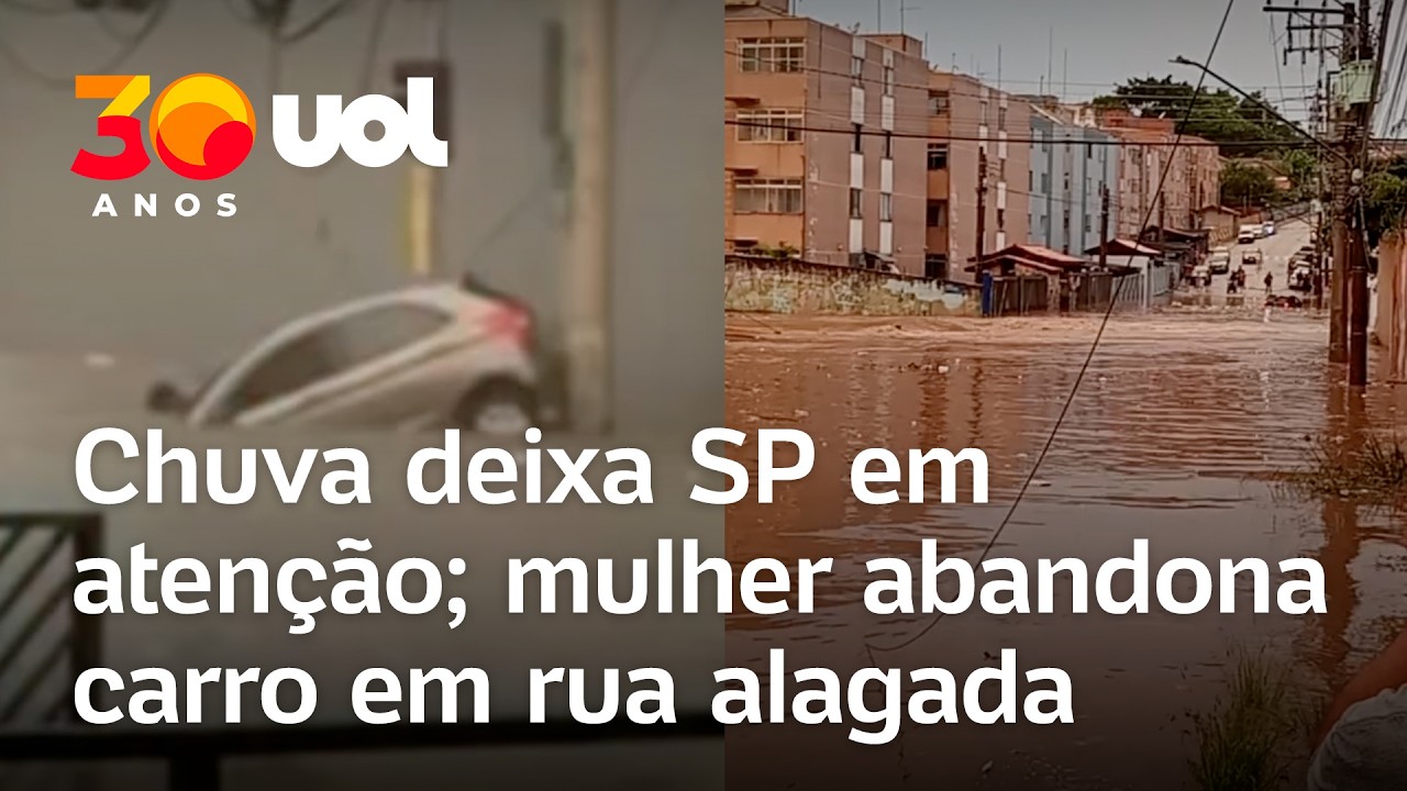 Mulher deixa carro ao ficar presa em enchente em SP; chuva deixa região metropolitana em alerta