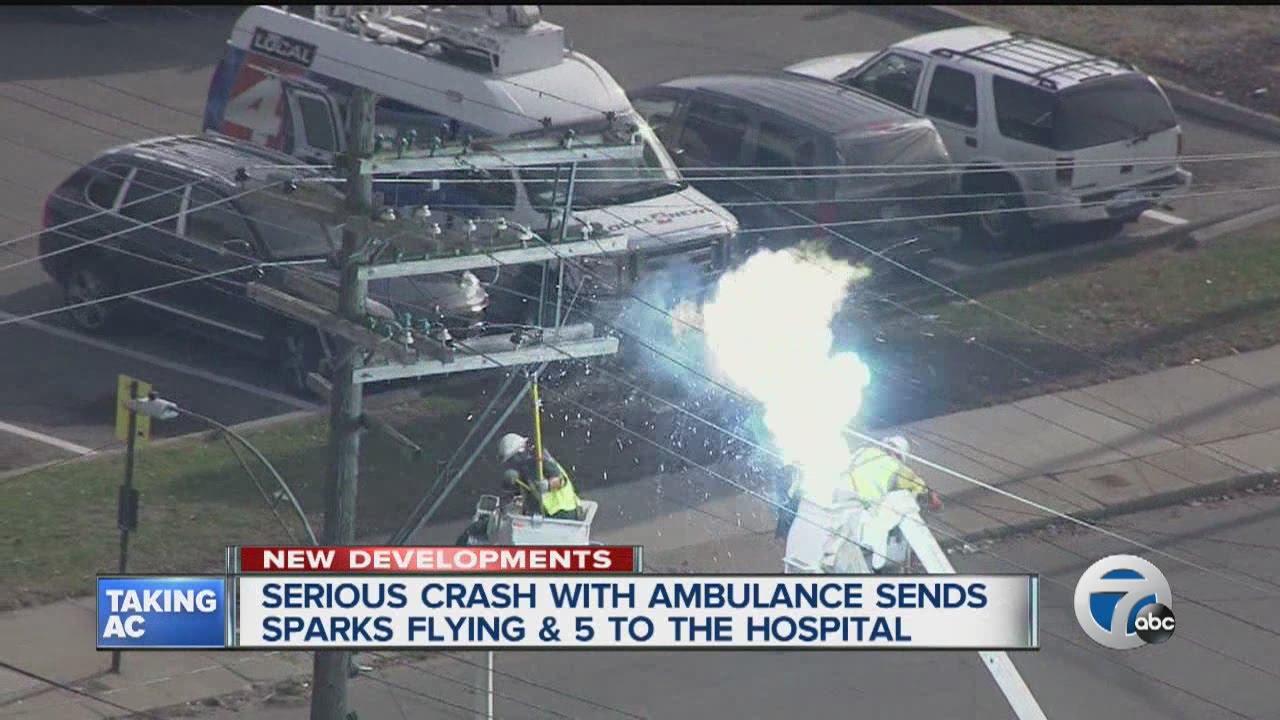 Sparks fly after ambulance crashes into power pole