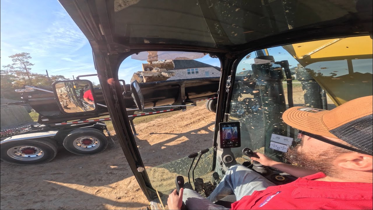 loading broken concrete onto end dump trailer (CAB VIEW)