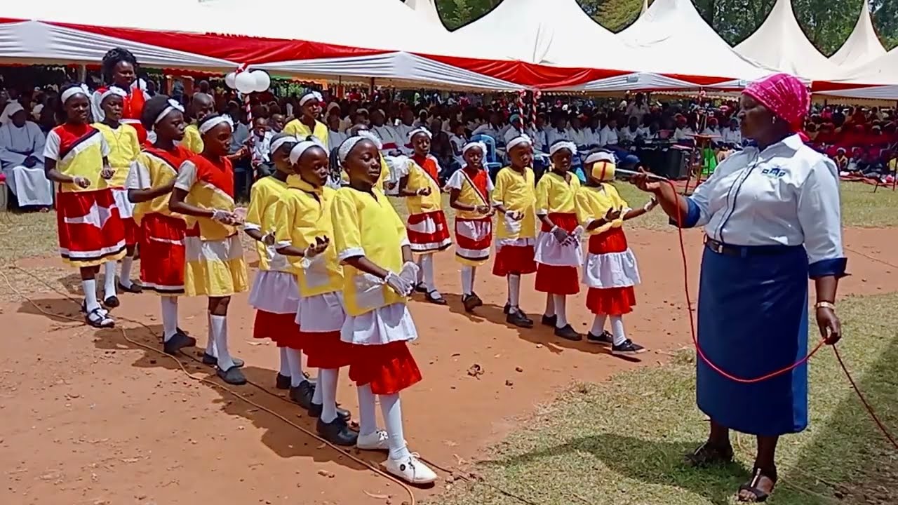 PMC KIMININI PARISH (ST. PETER'S CLEVER) PRESENTING POEM TO THANK BISHOP HENRY JUMA ODONYA