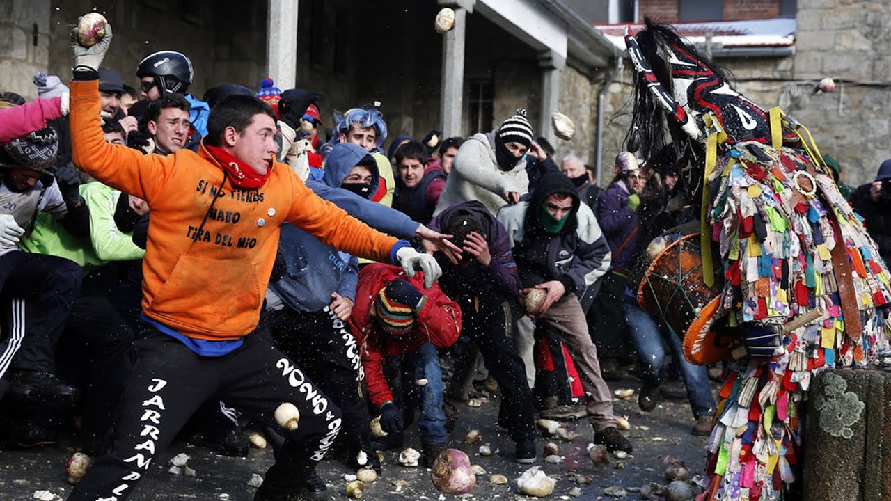 Crowds throw turnips at the &lsquo;Jarramplas&rsquo; during 'brutal but emotional' traditional Spanish festival