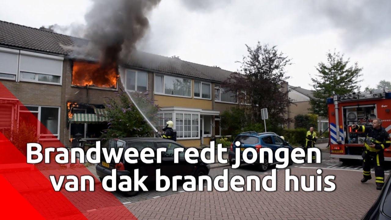 Brandweer redt jongen van dak bij uitslaande brand in Tilburg