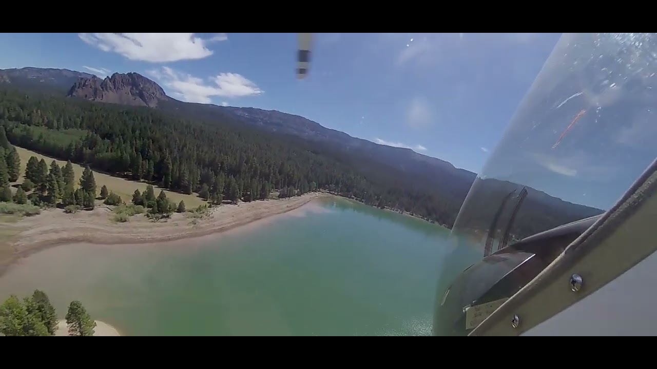 Buzzing the trees for mountain lake grass strip landing at 3000' in a Rotorway 162F helicopter