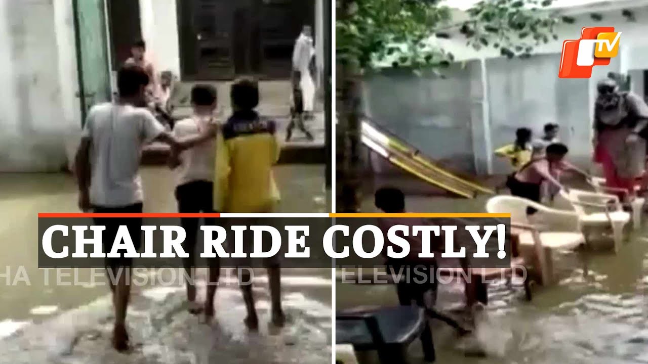Viral Video | Teacher Climbs Chair To Cross Waterlogged Area Outside UP School, Suspended By Admin