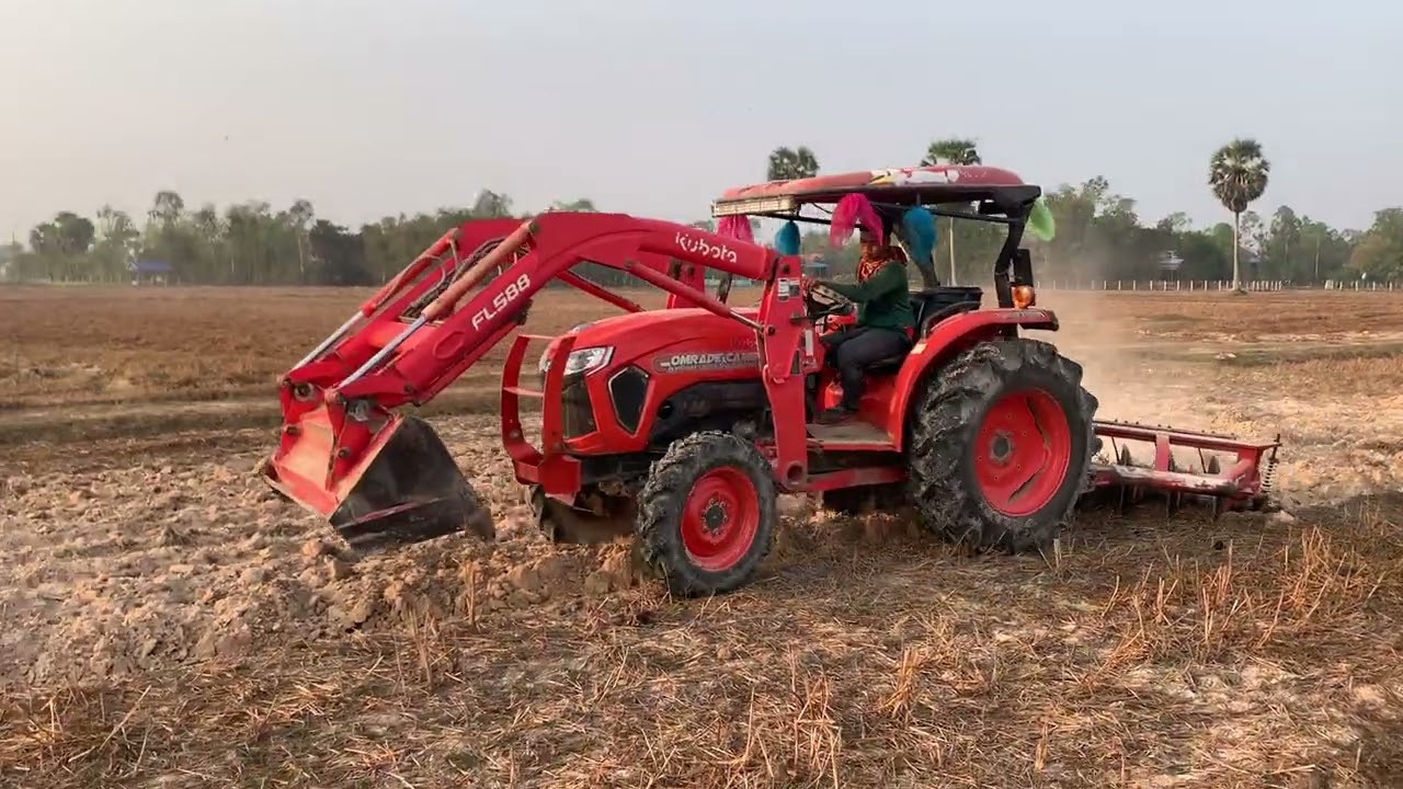 Tractor plowing the soil FL5018