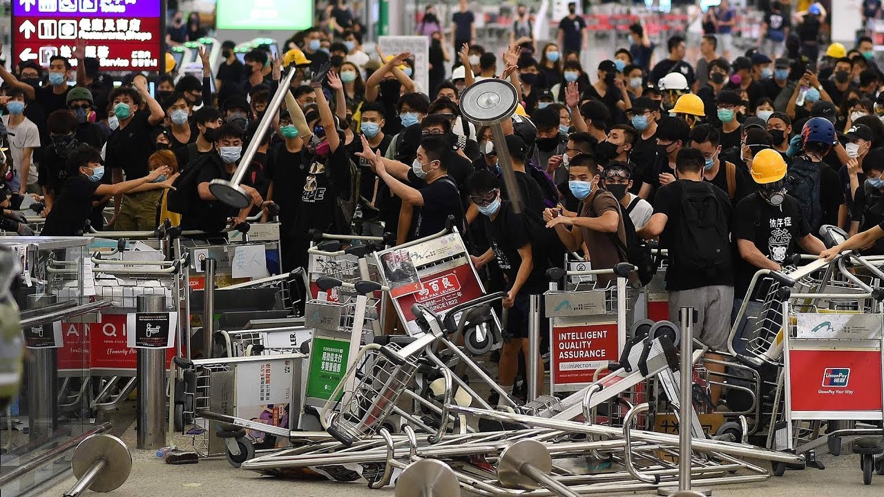 Violent protests at Hong Kong airport trigger public indignation