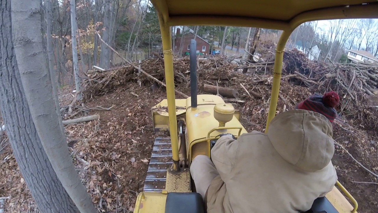 john deere 350 pushing brush