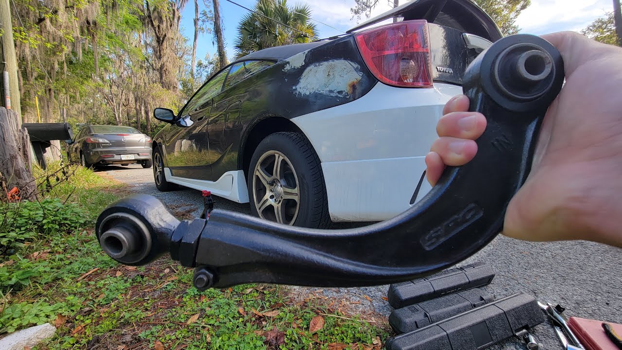 How to Replace the Rear Control Arms on a 2000 Toyota Celica: