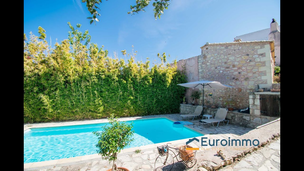 North Rethymno 2 Traditional Stone Villas for sale, with distant sea views.